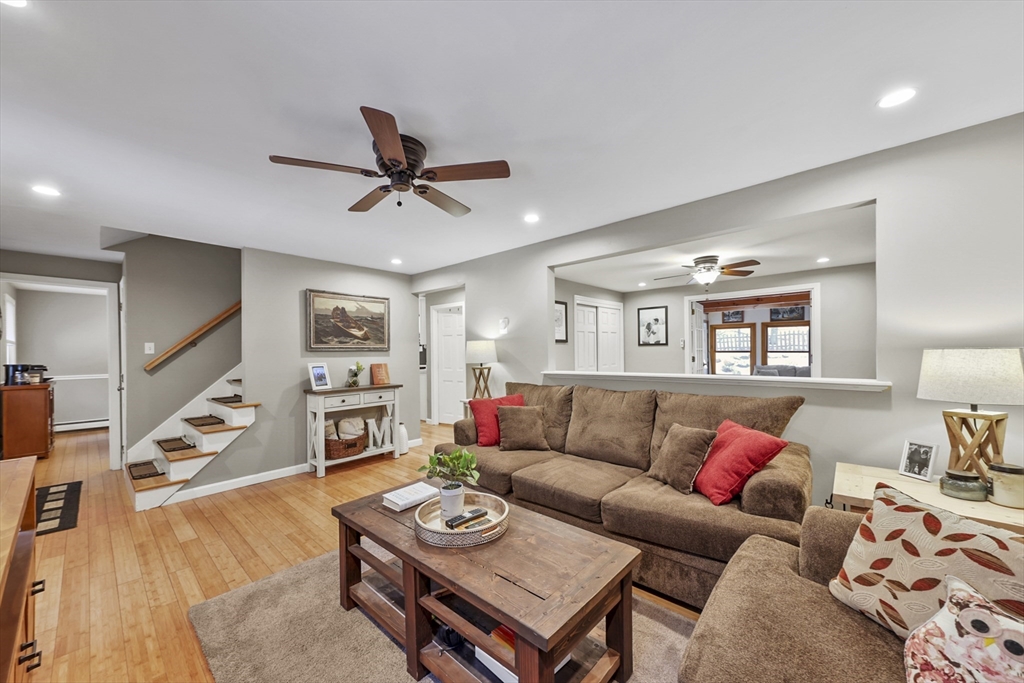 135 Conant Road Nashua, NH 03062 - Photo 5 of 40 a living room with furniture and wooden floor