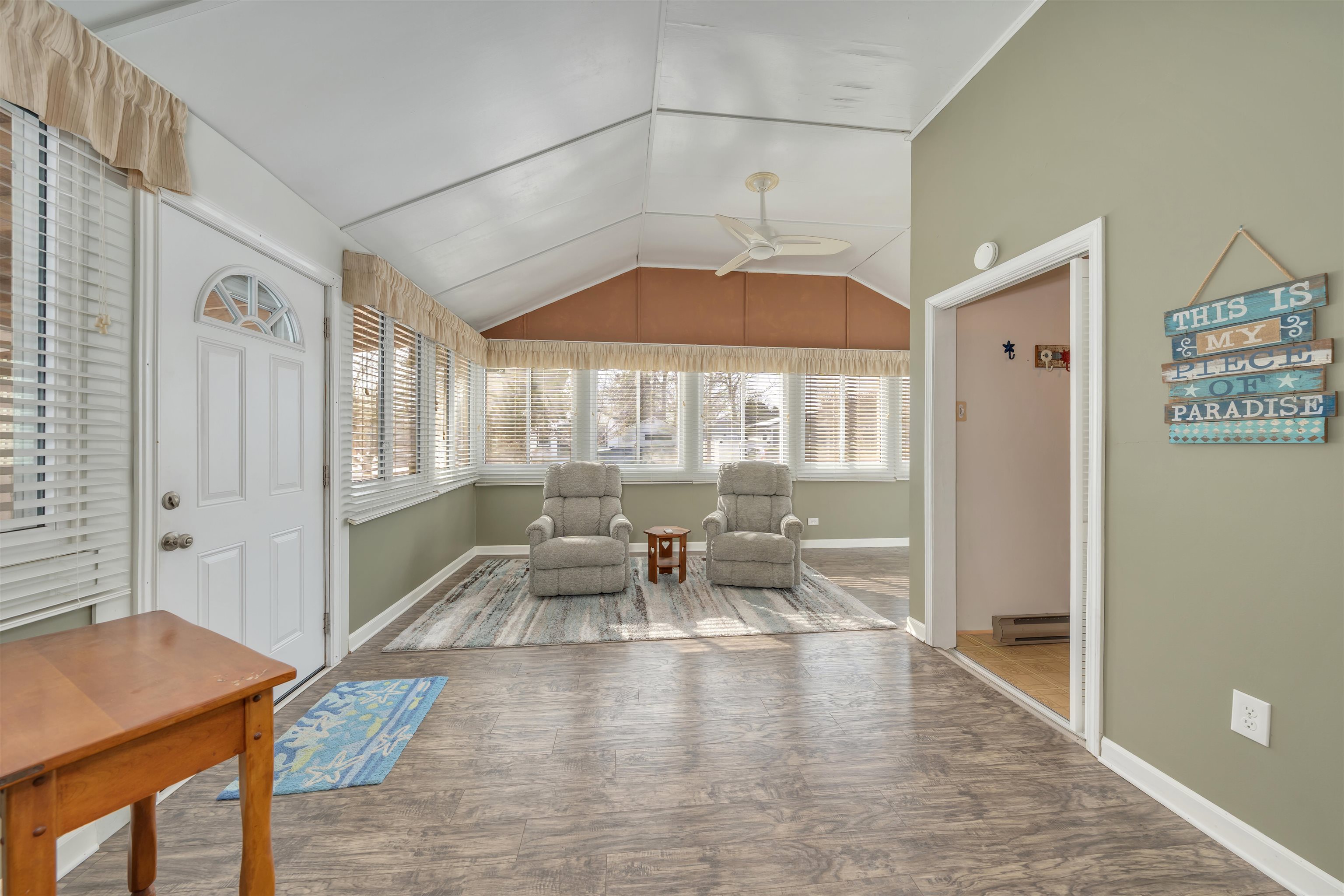 48 Spruce Avenue Villas, NJ 08251 - Photo 11 of 37 a dining room with furniture a chandelier and wooden floor