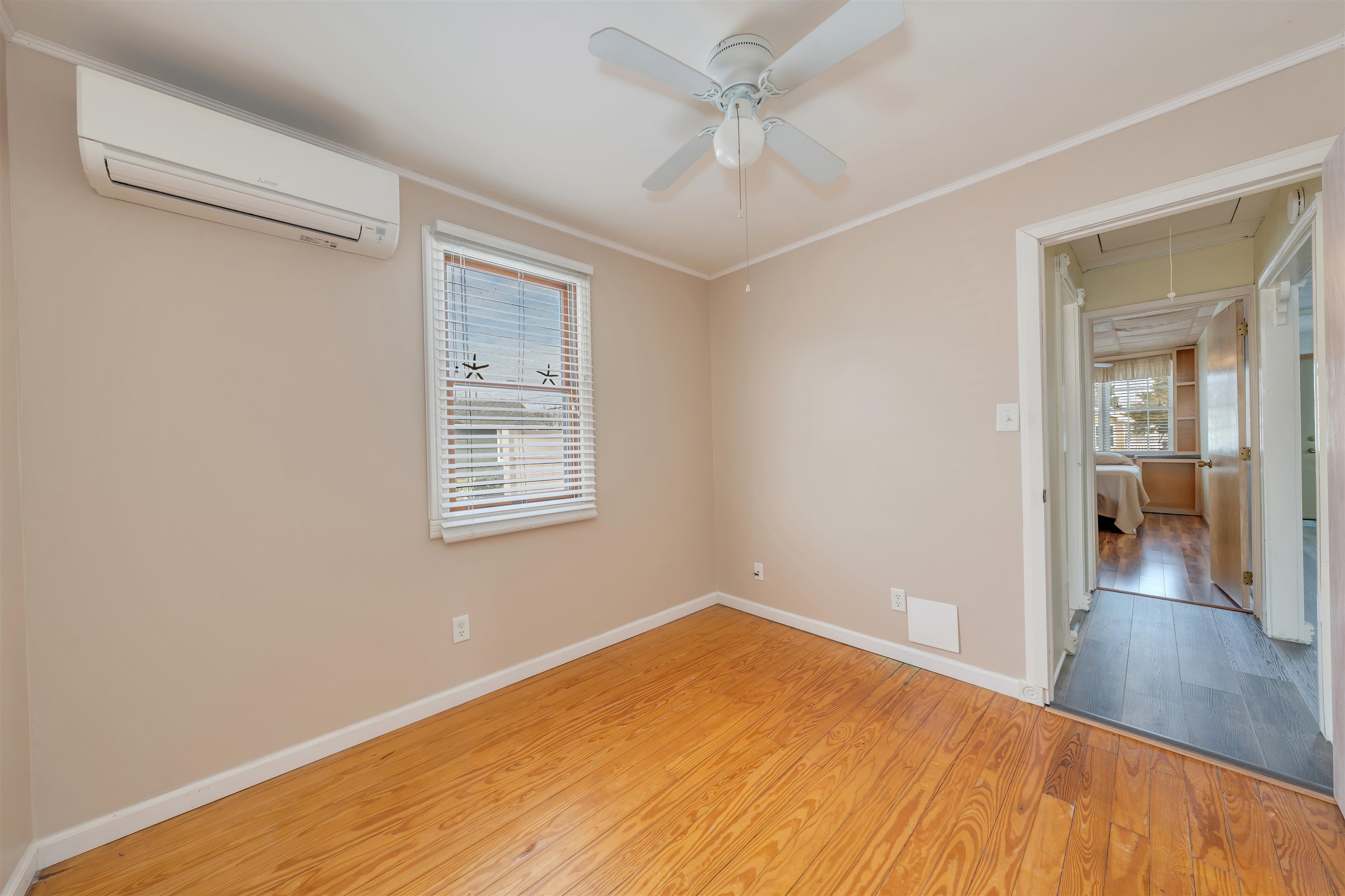 48 Spruce Avenue Villas, NJ 08251 - Photo 16 of 37 a view of a room with wooden floor and a ceiling fan