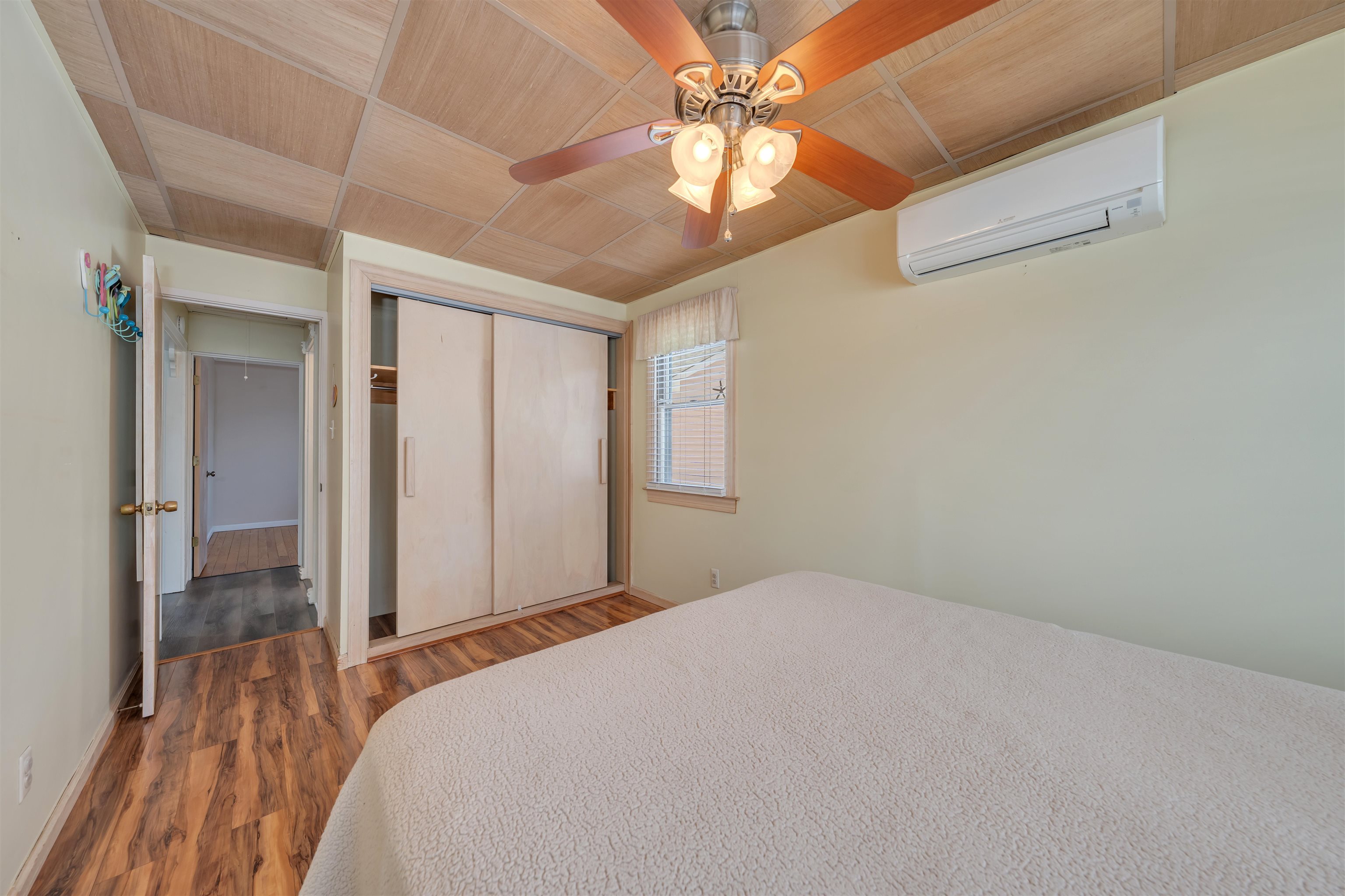48 Spruce Avenue Villas, NJ 08251 - Photo 19 of 37 a bedroom with a bed and a chandelier