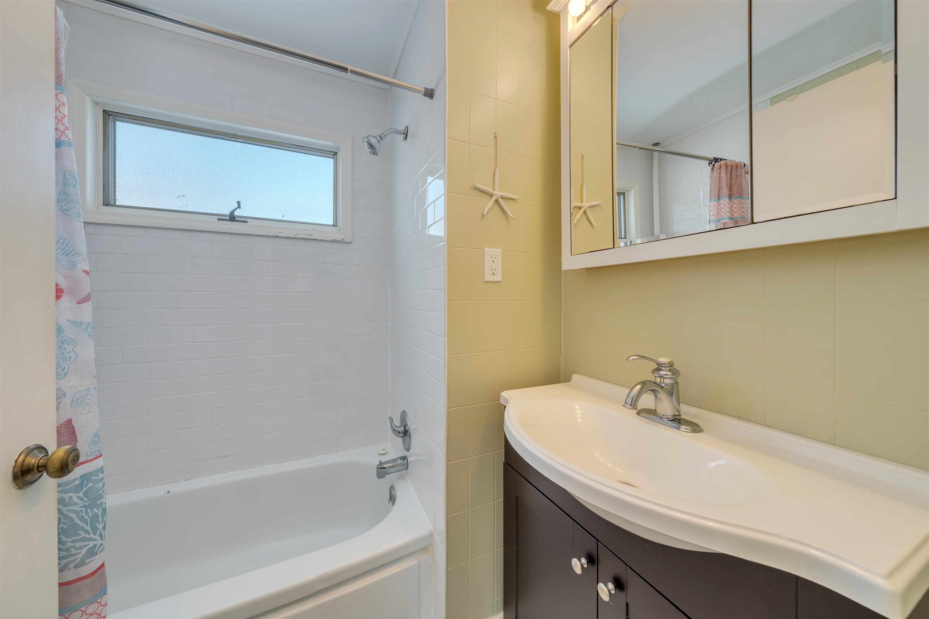 48 Spruce Avenue Villas, NJ 08251 - Photo 20 of 37 a bathroom with a sink a mirror and a bathtub