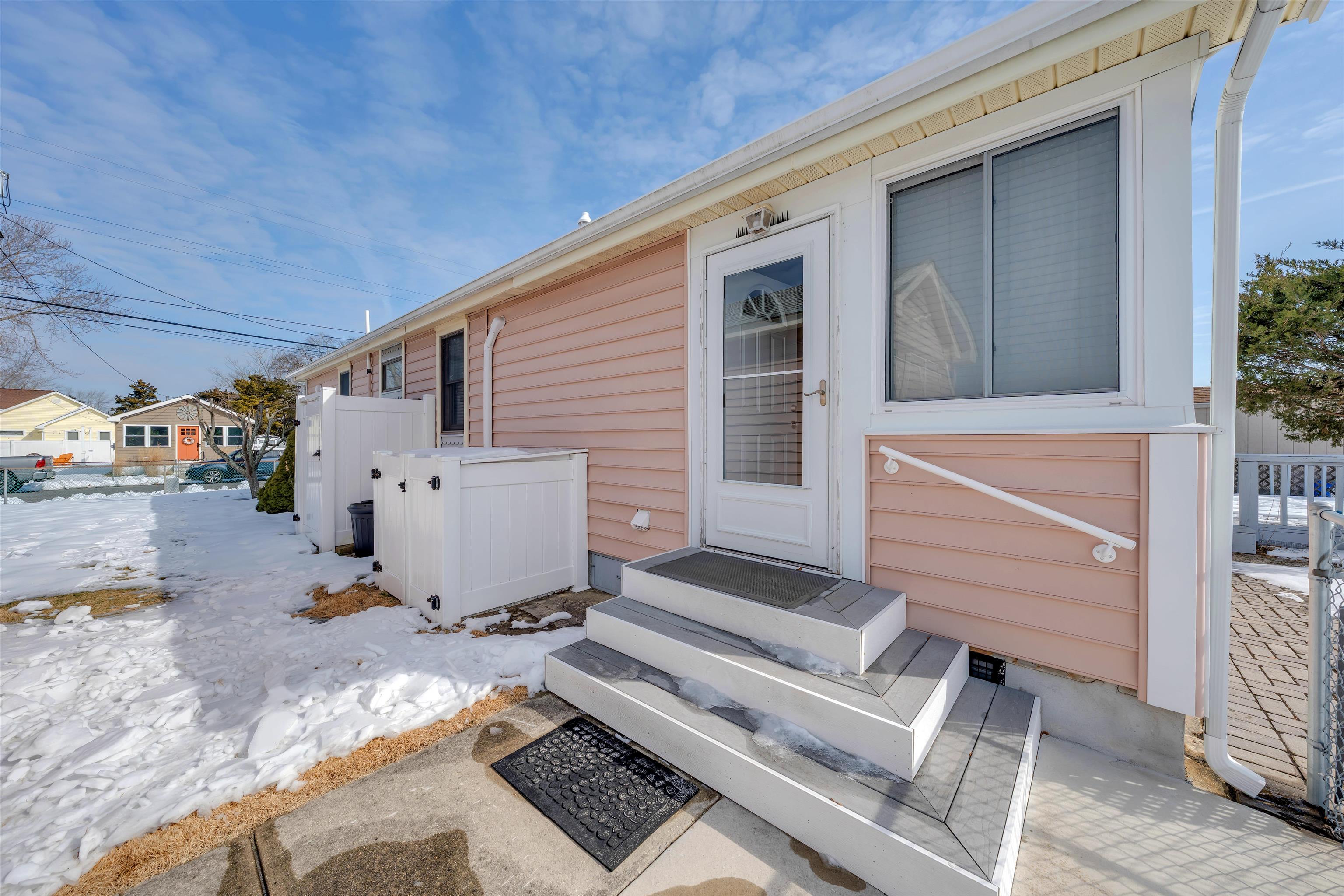 48 Spruce Avenue Villas, NJ 08251 - Photo 29 of 37 a view of a patio with table and chairs with wooden fence