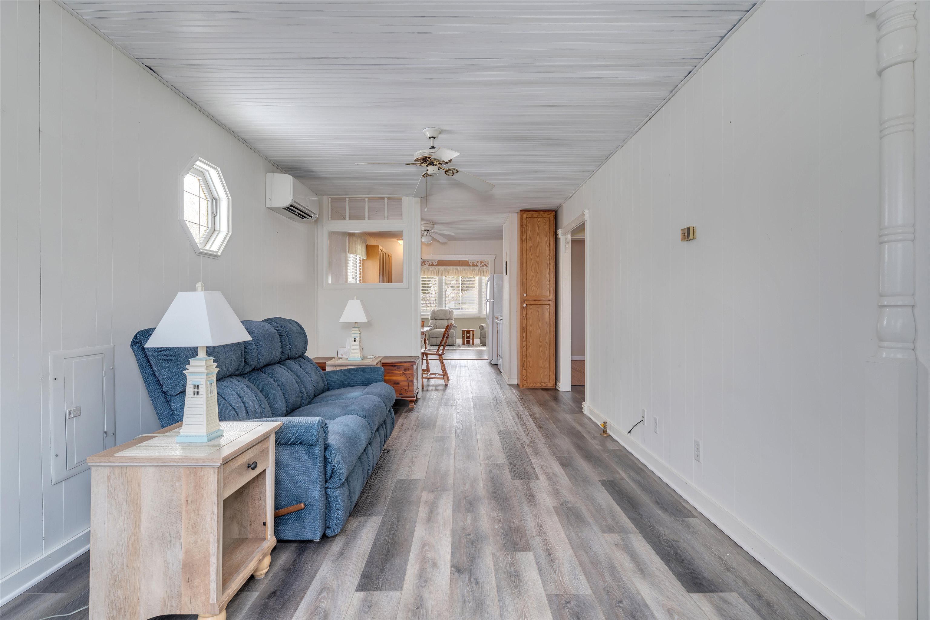 48 Spruce Avenue Villas, NJ 08251 - Photo 6 of 37 a living room with furniture and a chandelier