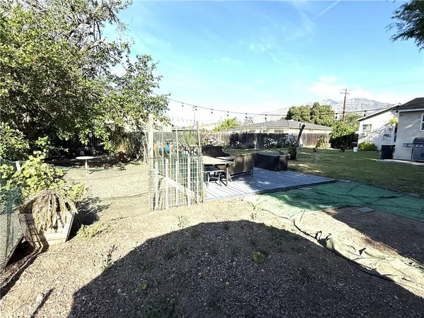 a view of a backyard with sitting area
