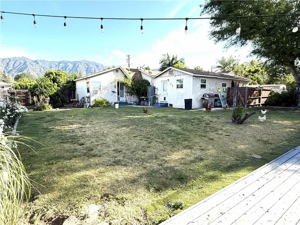 a view of a house with a back yard