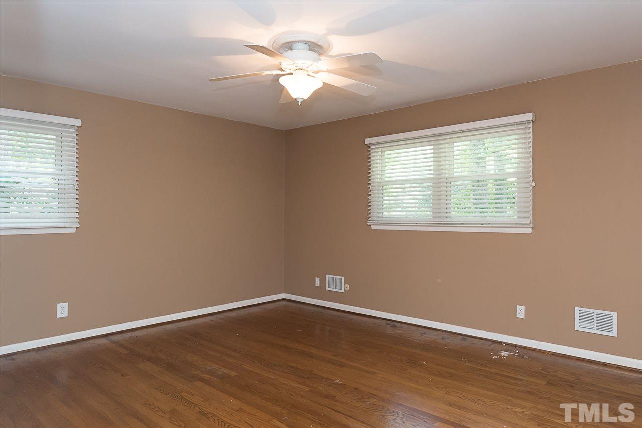 4300 Union Street Raleigh, NC 27609 - Photo 14 of 23 an empty room with wooden floor and windows