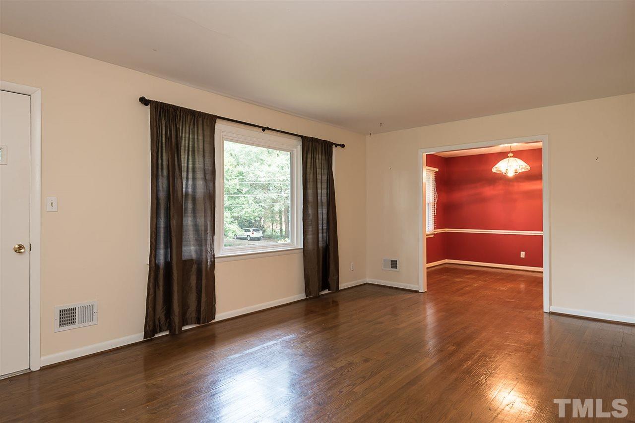 4300 Union Street Raleigh, NC 27609 - Photo 4 of 23 an empty room with wooden floor and windows