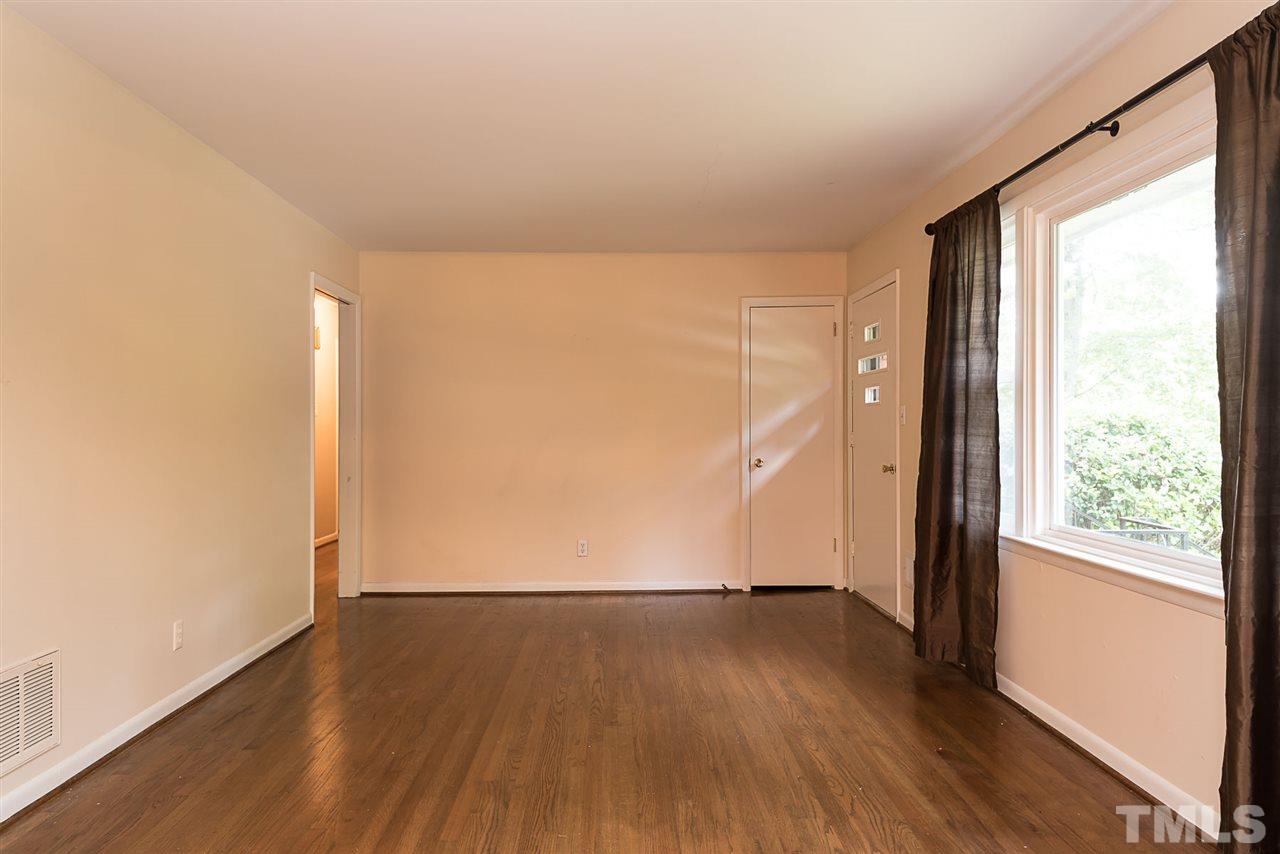 4300 Union Street Raleigh, NC 27609 - Photo 5 of 23 an empty room with wooden floor and windows