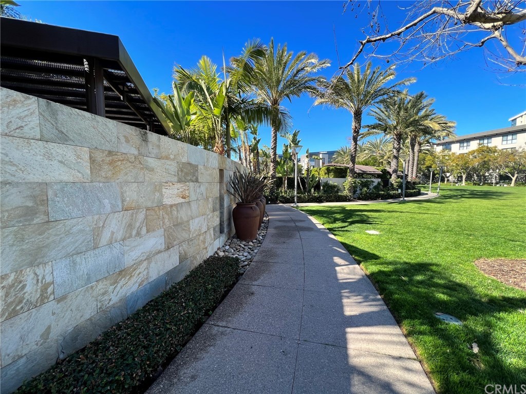 402 Rockefeller, Unit 212 Irvine, CA 92612 - Photo 24 of 27 a view of a backyard with palm trees
