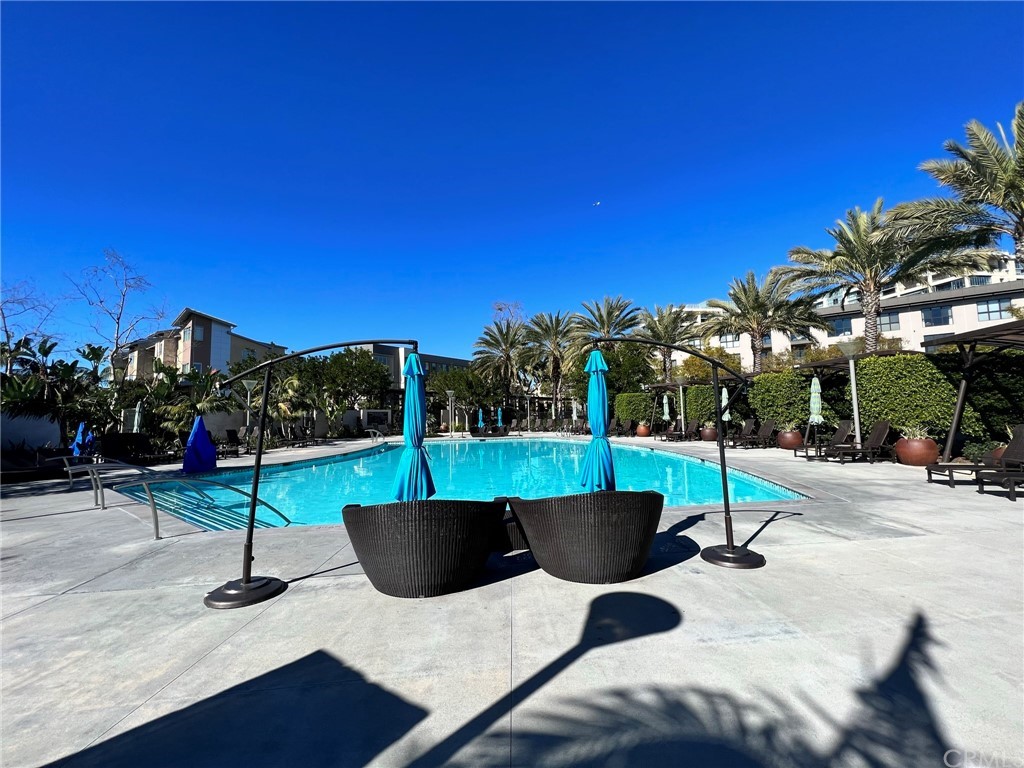 402 Rockefeller, Unit 212 Irvine, CA 92612 - Photo 25 of 27 a view of a patio with swimming pool