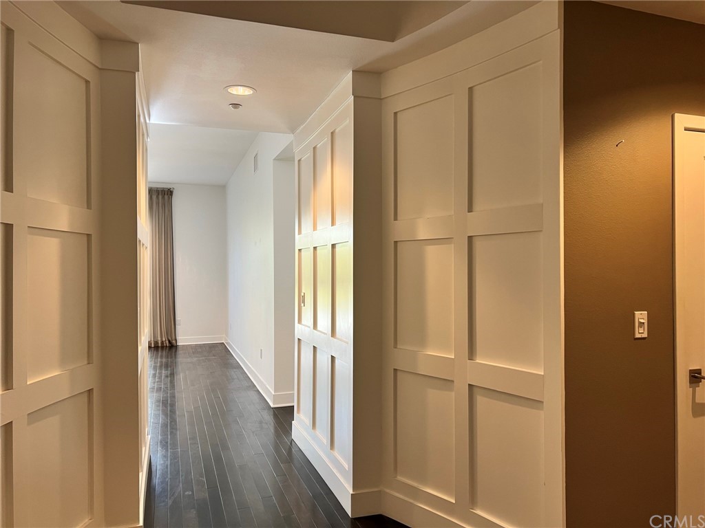 402 Rockefeller, Unit 212 Irvine, CA 92612 - Photo 5 of 27 a view of a hallway with wooden floor