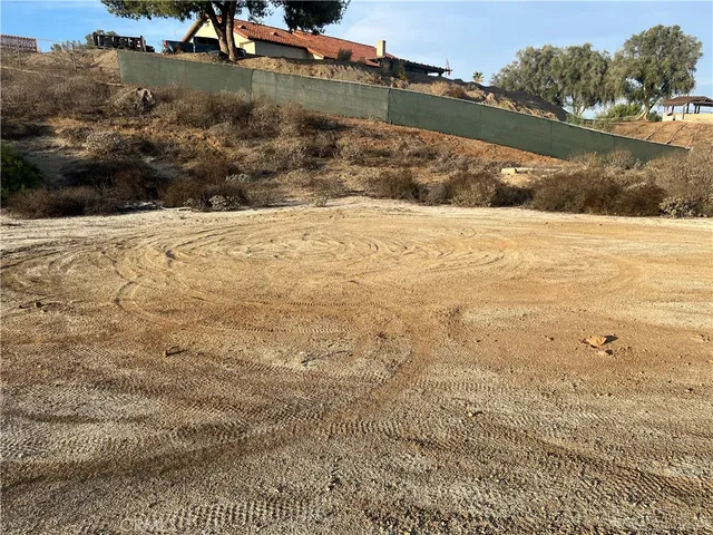 a view of a city with lush green forest
