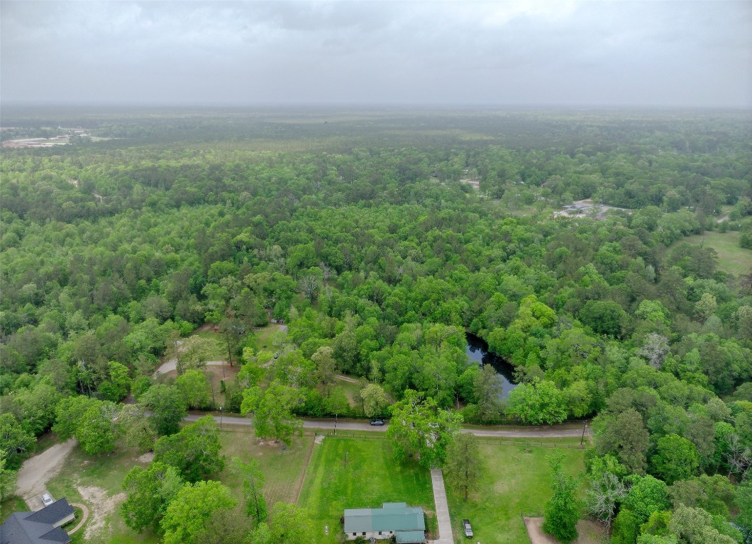 Tbd Drivers Road Splendora, TX 77372 - Photo 12 of 18 an aerial view of residential houses with outdoor space and trees