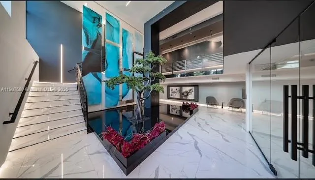 a view of two chairs in the patio