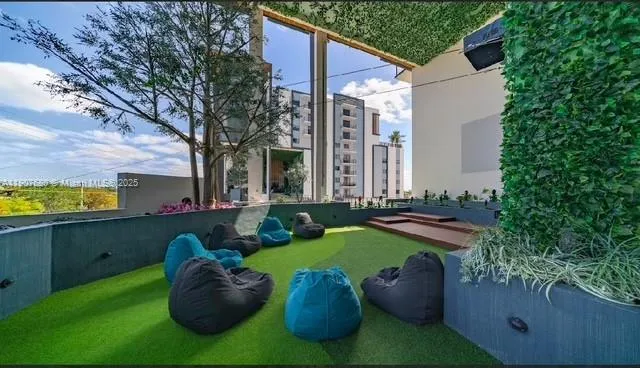 an aerial view of a house with outdoor space