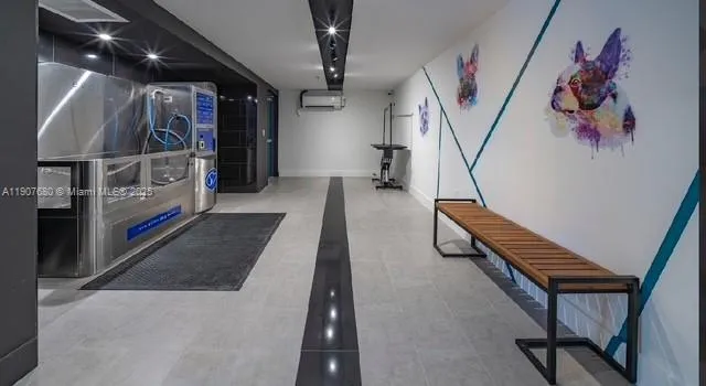 front view of house with a yard and palm trees