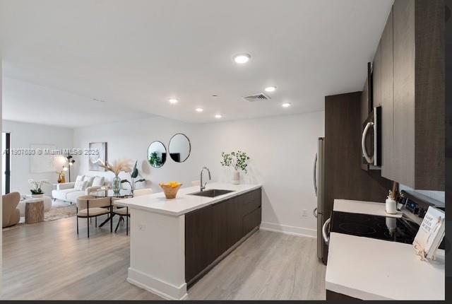 475 Southeast 1st Street, Unit 805A Pompano Beach, FL 33060 - Photo 5 of 19 a living room with furniture and a wooden floor