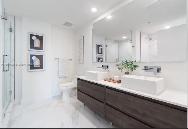 a bathroom with a bathtub and shower