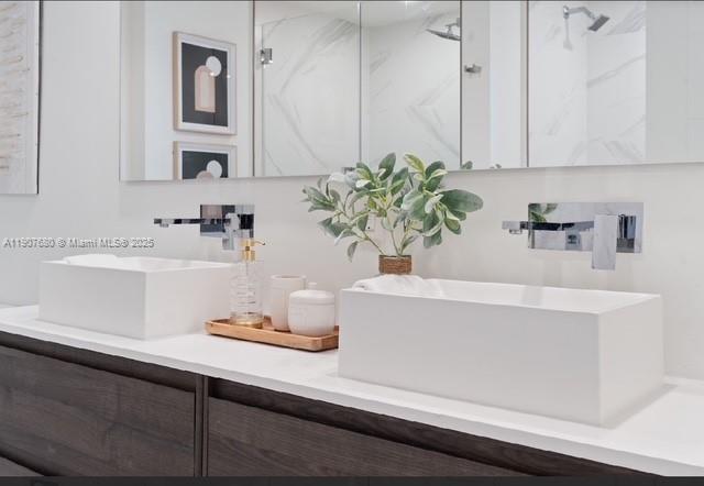 475 Southeast 1st Street, Unit 805A Pompano Beach, FL 33060 - Photo 9 of 19 a bathroom with a sink a mirror and vanity