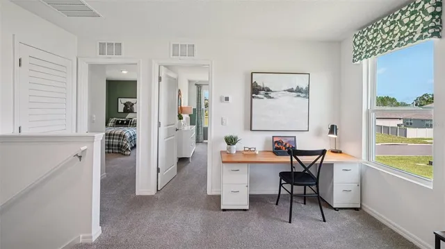 a dining room with furniture and window