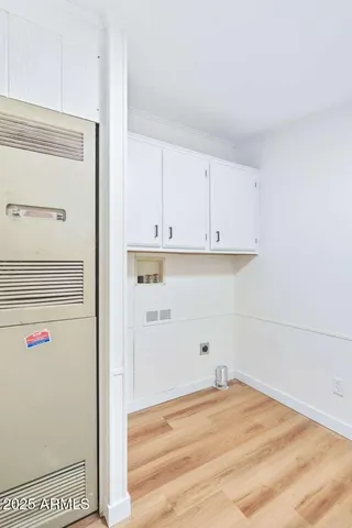 a view of cabinets and wooden floor