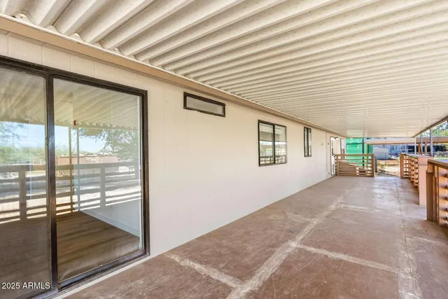 a view of a porch with wooden floor and roof