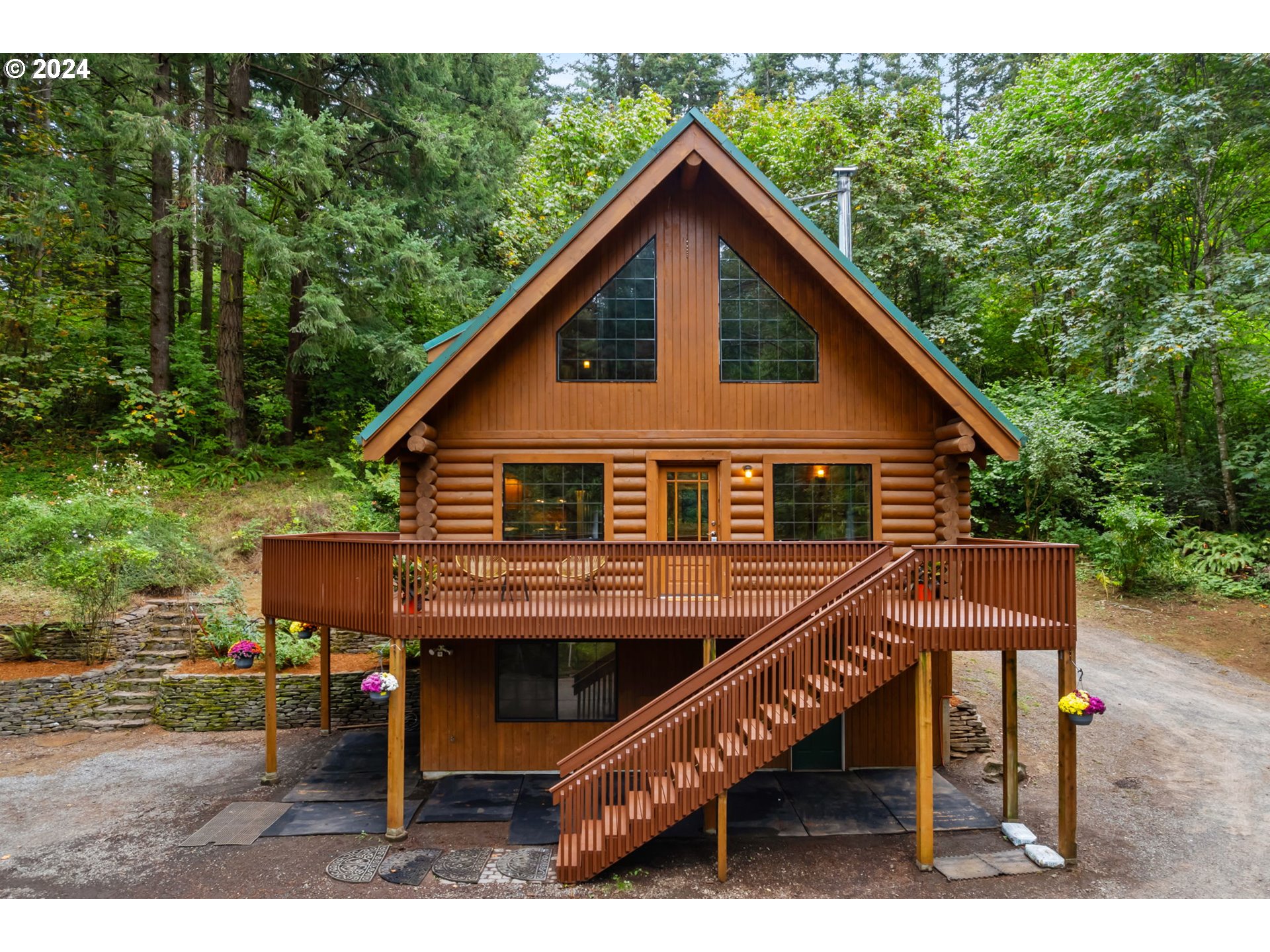 24271 South Newkirchner Road Oregon City, OR 97045 - Photo 1 of 41 a view of a house with a small deck and wooden floor