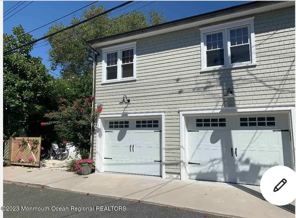 a view of a house with a patio and backyard