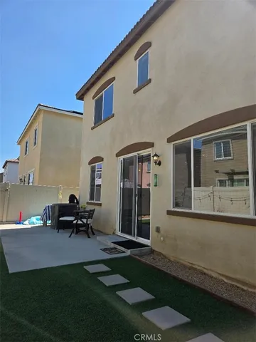 a view of backyard with outdoor seating
