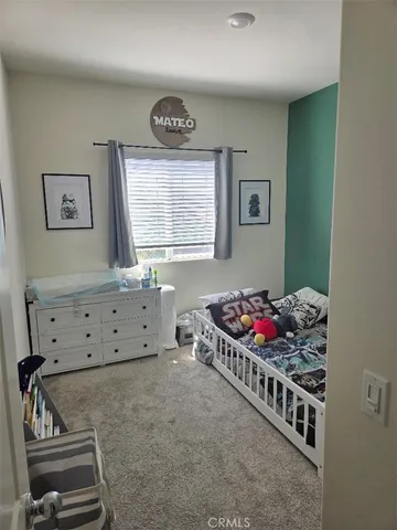 a room with toys and dresser