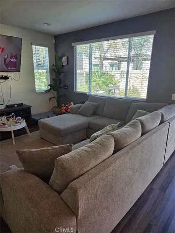 a living room with furniture and a window