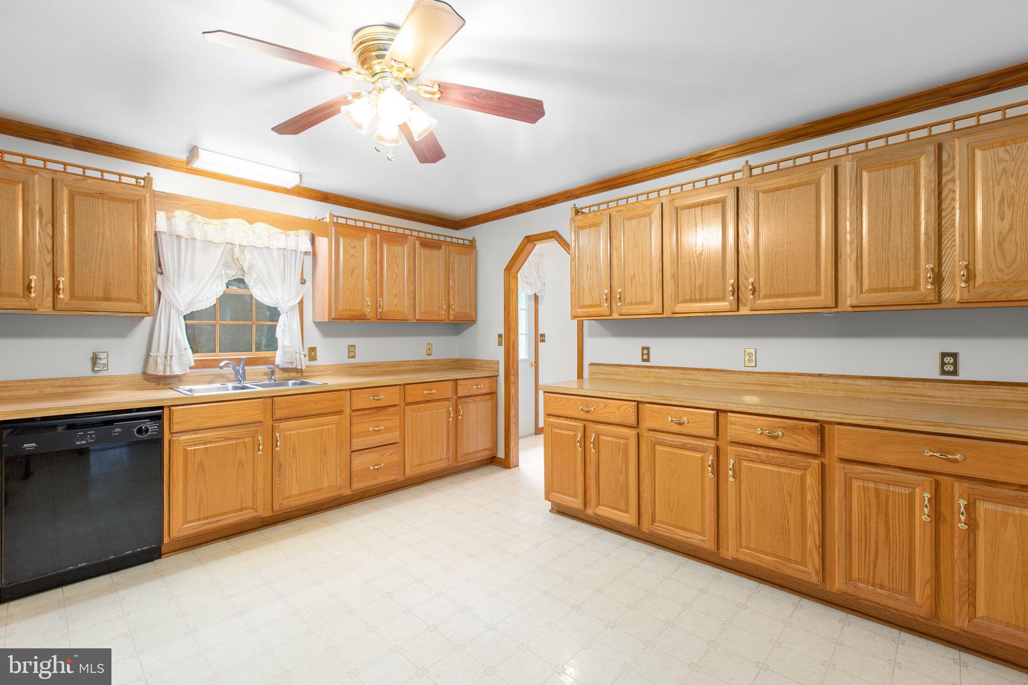 6628 Courthouse Road Spotsylvania, VA 22551 - Photo 14 of 45 a large kitchen with kitchen island granite countertop a sink stainless steel appliances and cabinets