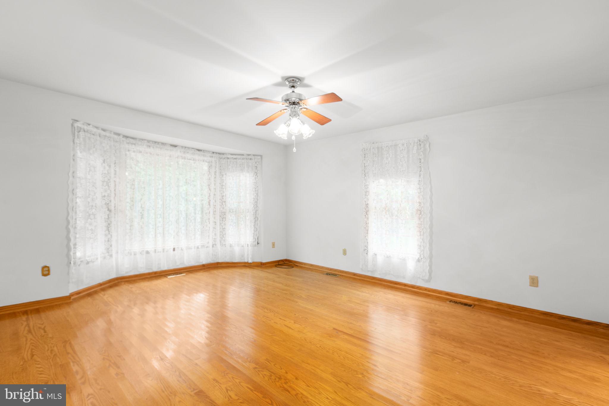 6628 Courthouse Road Spotsylvania, VA 22551 - Photo 19 of 45 wooden floor in an empty room with a window