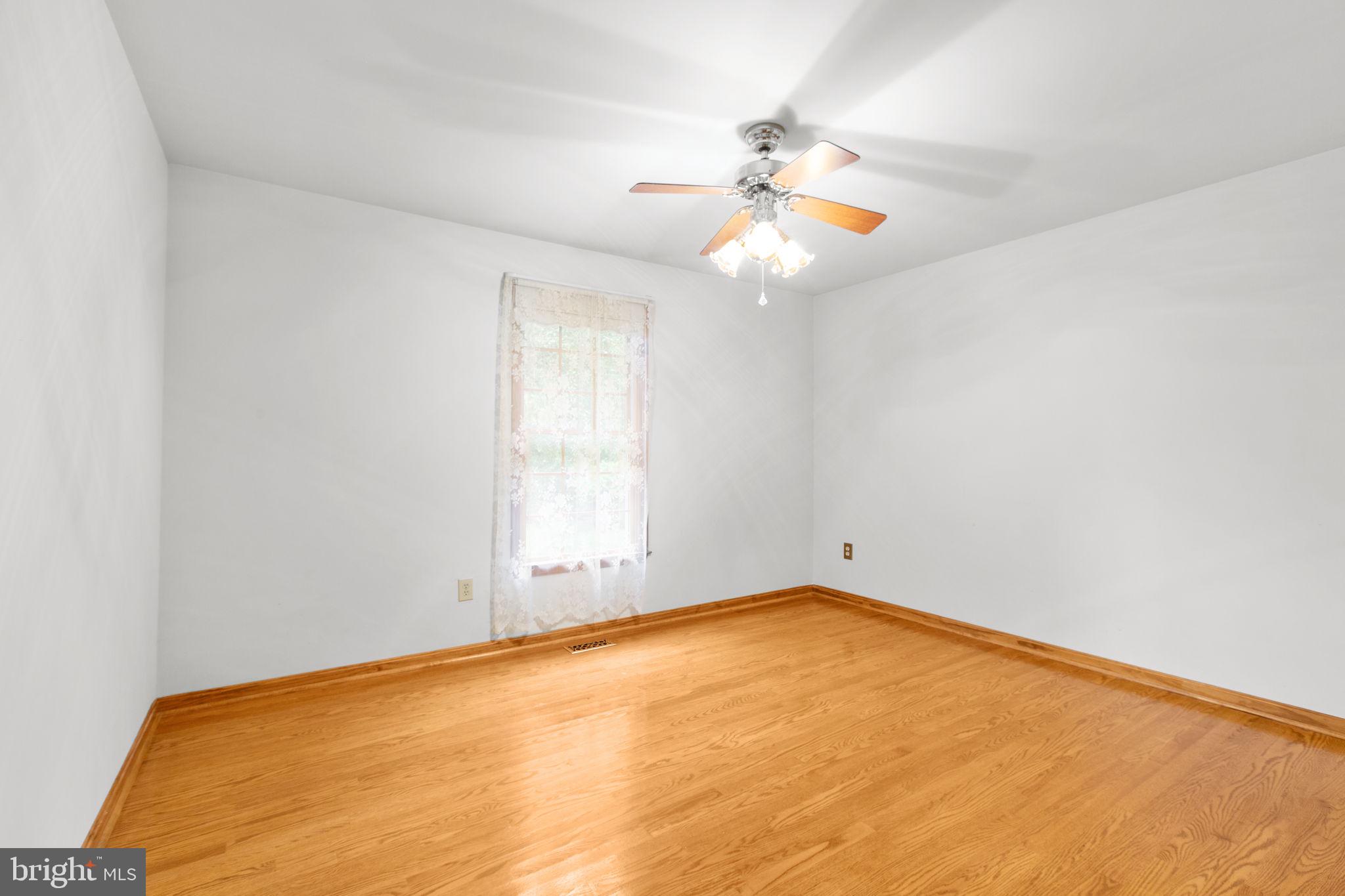 6628 Courthouse Road Spotsylvania, VA 22551 - Photo 22 of 45 an empty room with windows and fan