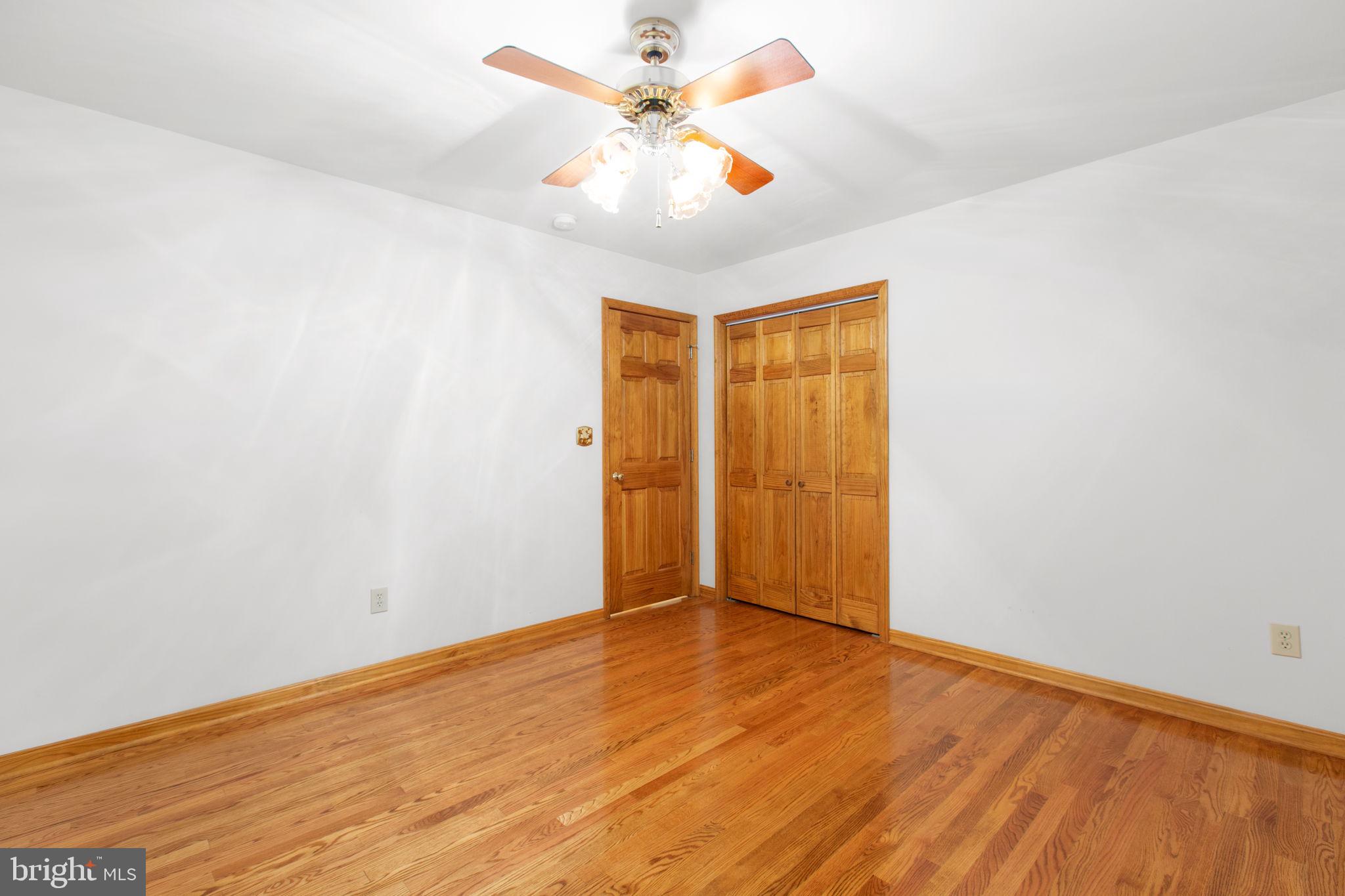 6628 Courthouse Road Spotsylvania, VA 22551 - Photo 23 of 45 wooden floor in an empty room
