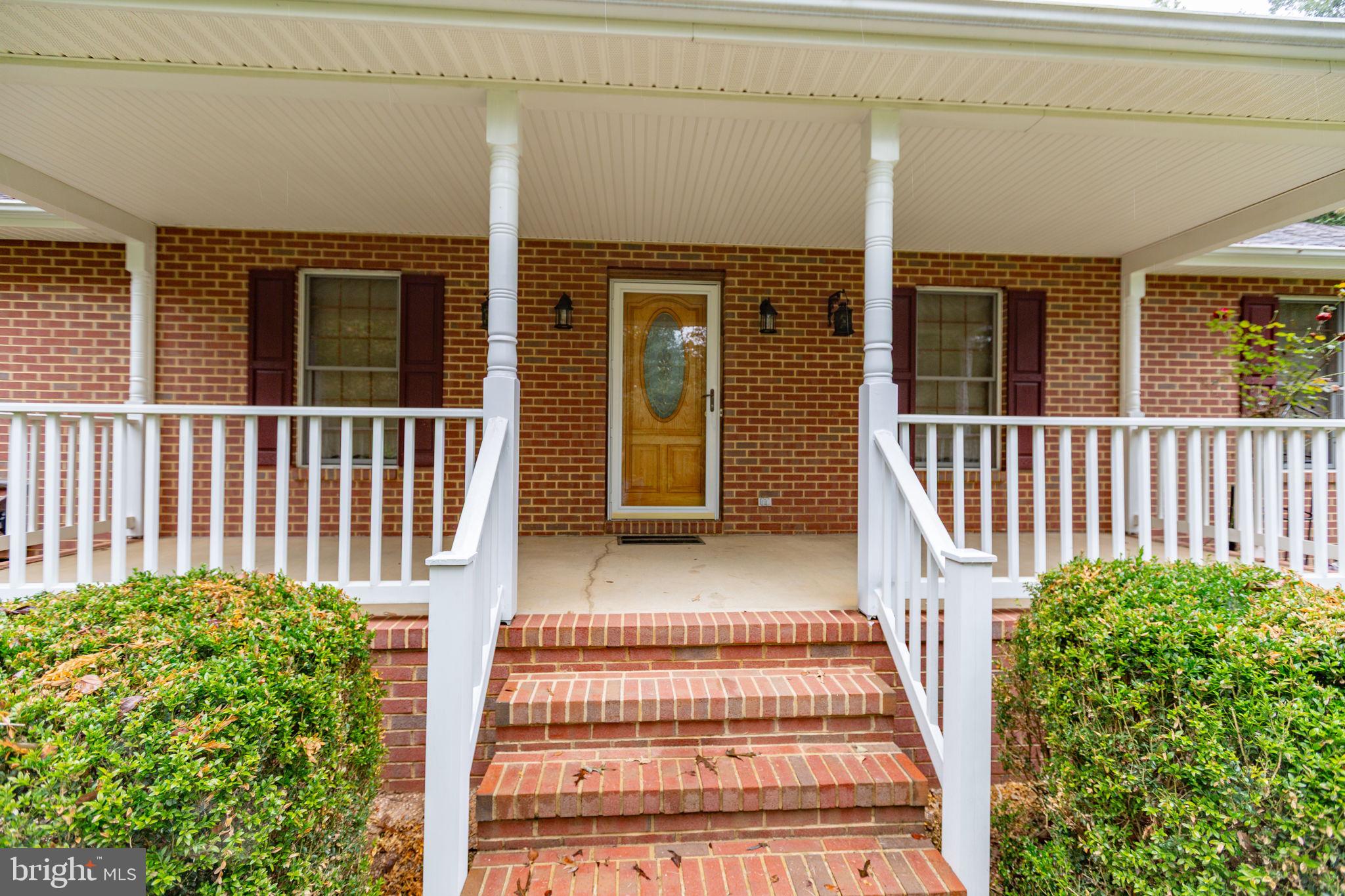 6628 Courthouse Road Spotsylvania, VA 22551 - Photo 30 of 45 a view of a house with porch and wooden floor