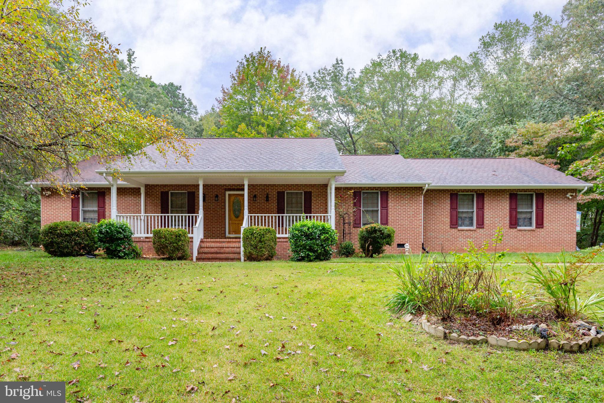 6628 Courthouse Road Spotsylvania, VA 22551 - Photo 34 of 45 a front view of a house with a yard and garage
