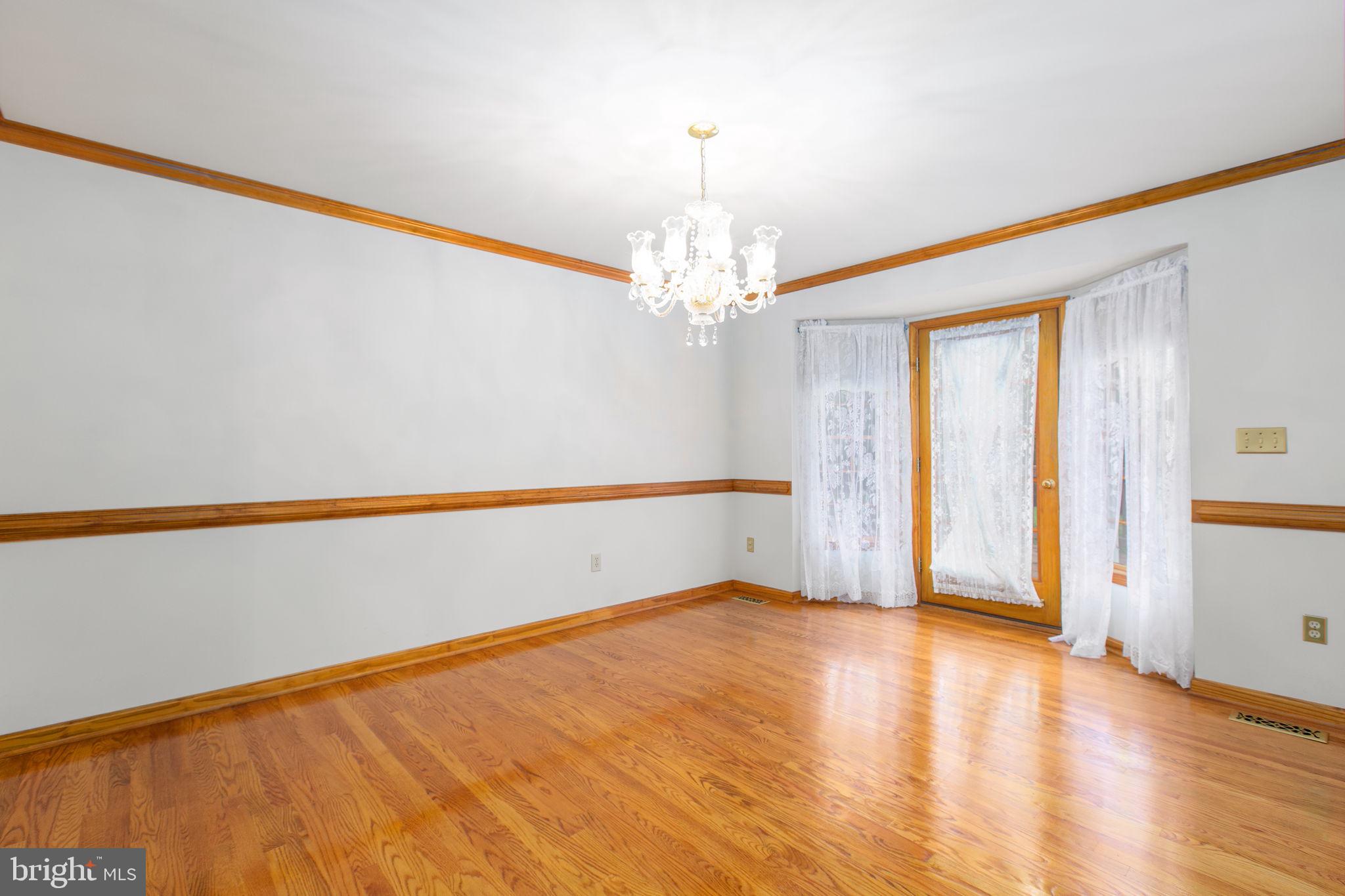 6628 Courthouse Road Spotsylvania, VA 22551 - Photo 4 of 45 a view of an empty room with wooden floor and a window