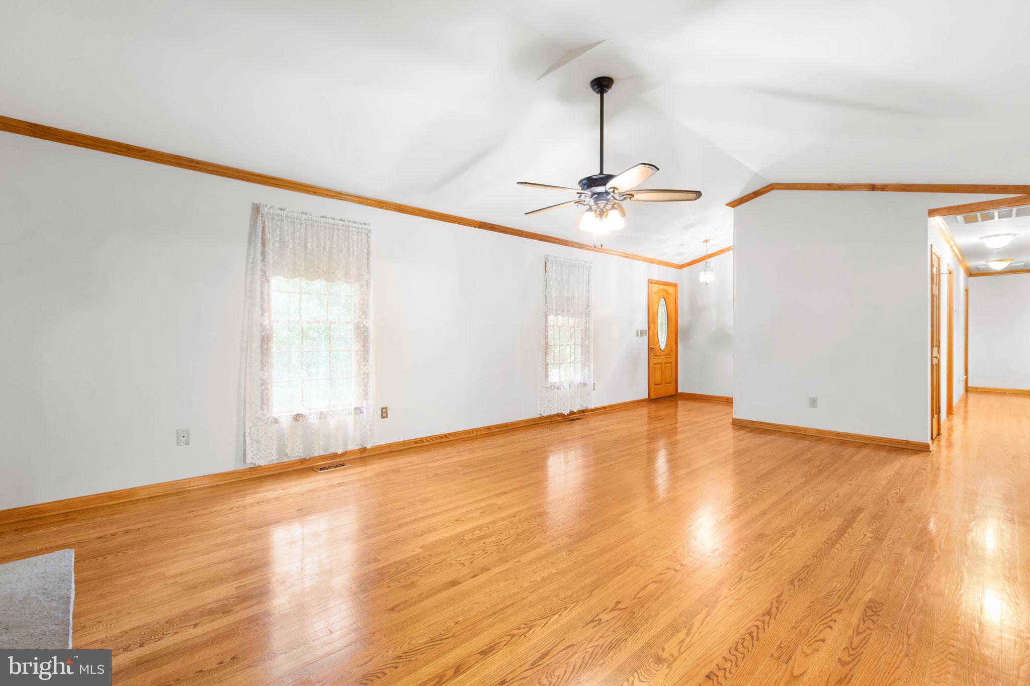 6628 Courthouse Road Spotsylvania, VA 22551 - Photo 7 of 45 a view of empty room with wooden floor and fan