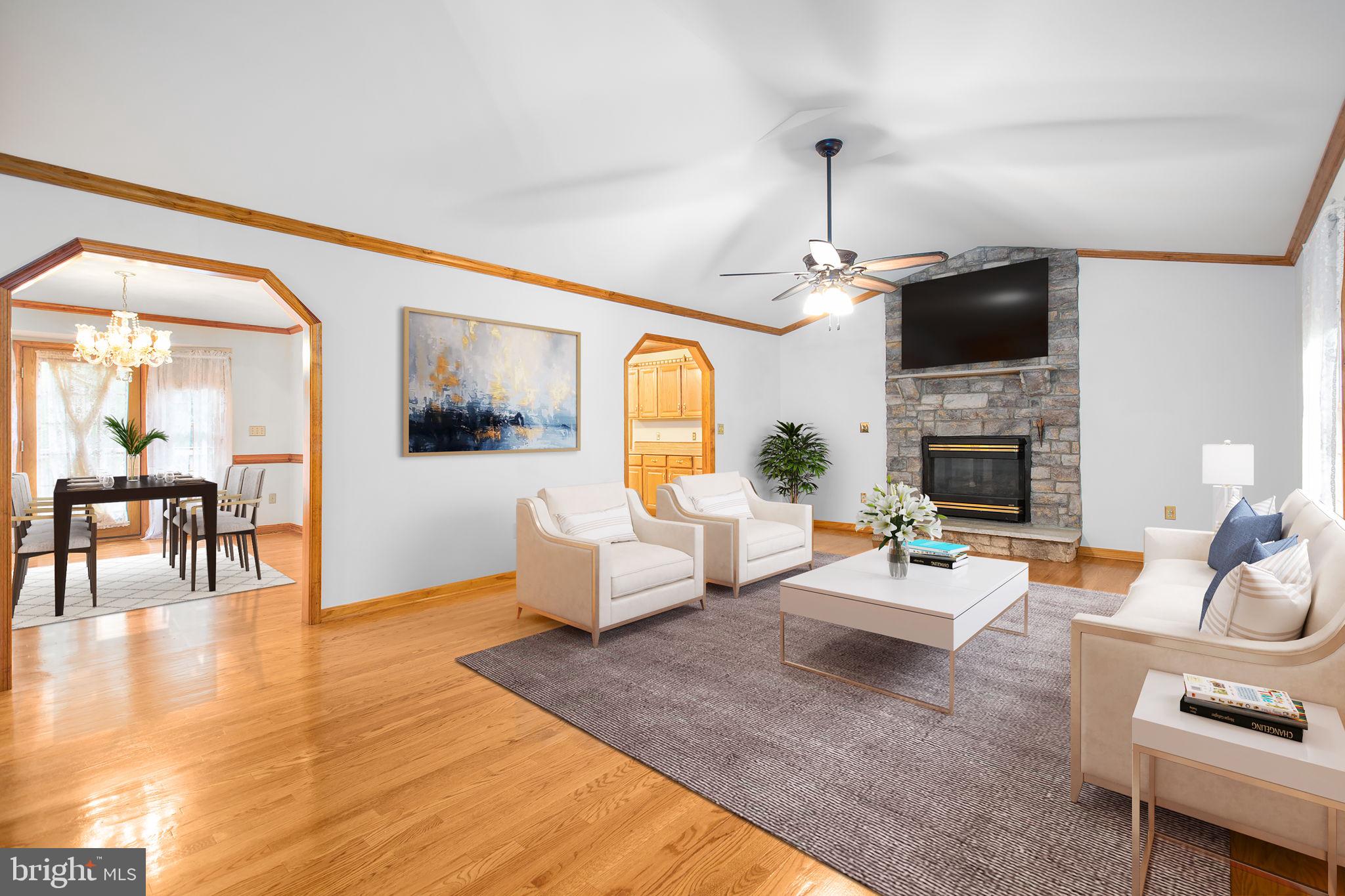 6628 Courthouse Road Spotsylvania, VA 22551 - Photo 10 of 45 a living room with fireplace furniture and a flat screen tv