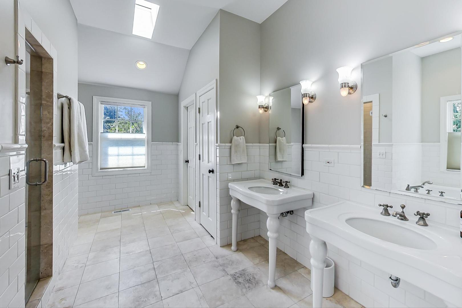 1387 Gettysburg Road Long Grove, IL 60047 - Photo 21 of 46 a bathroom with a sink double vanity and a mirror
