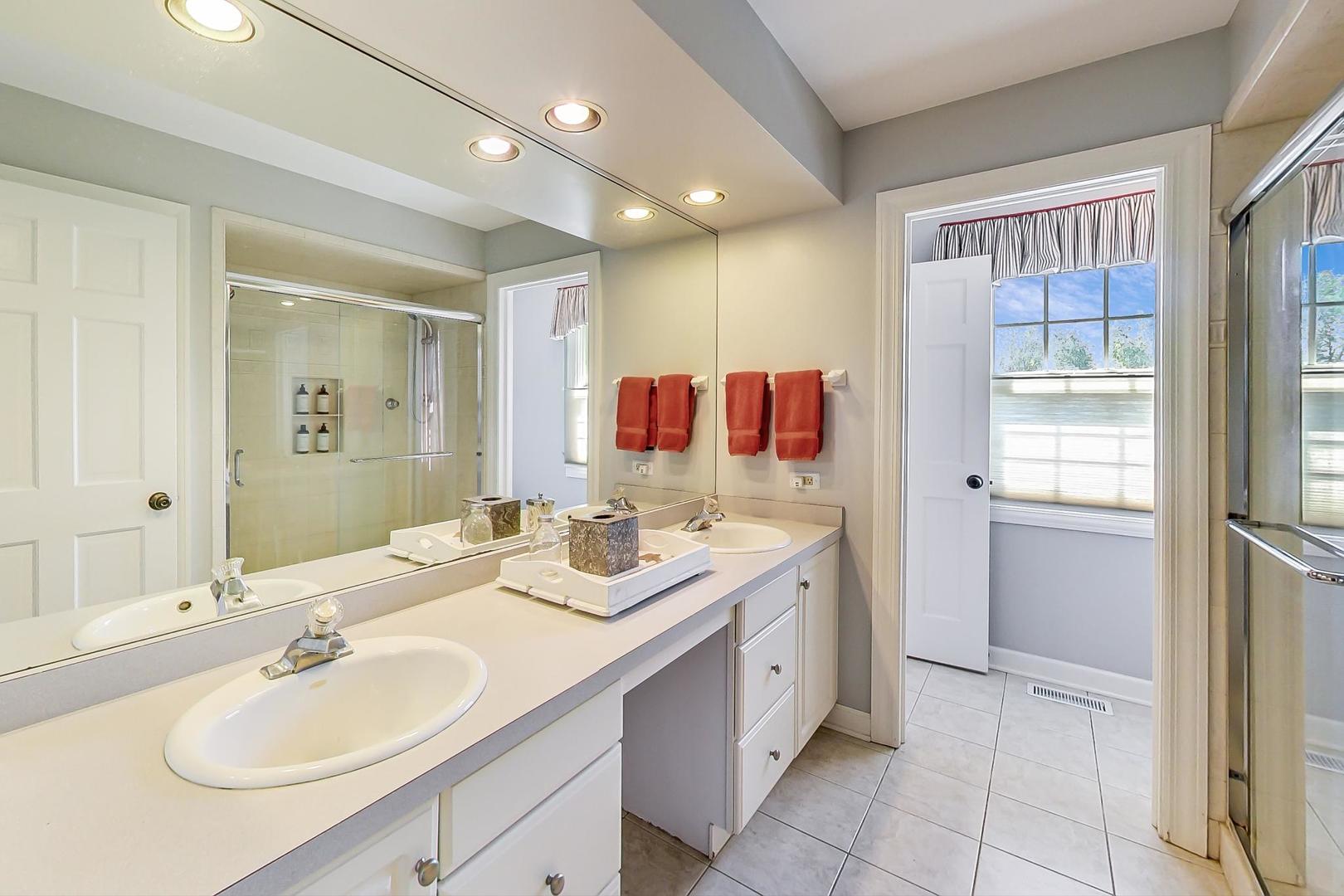 1387 Gettysburg Road Long Grove, IL 60047 - Photo 31 of 46 a bathroom with a sink vanity and mirror