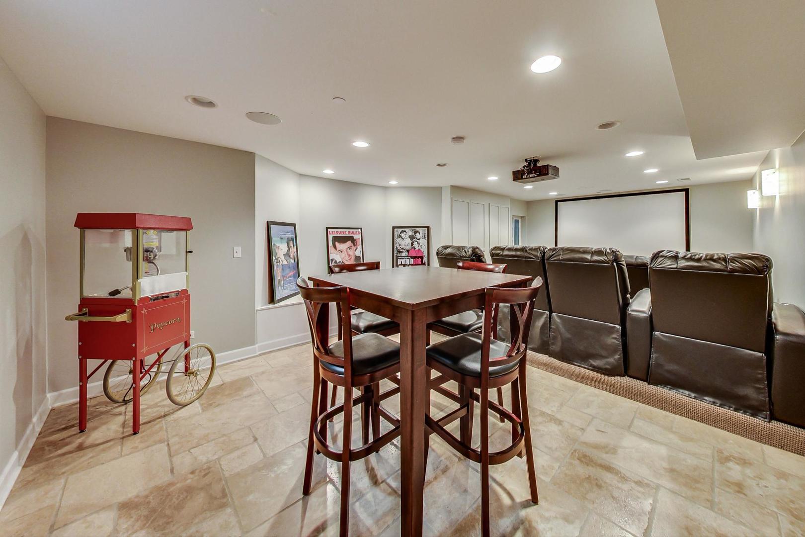 1387 Gettysburg Road Long Grove, IL 60047 - Photo 32 of 46 a dining area with stainless steel appliances kitchen island granite countertop a dining table chairs and a refrigerator