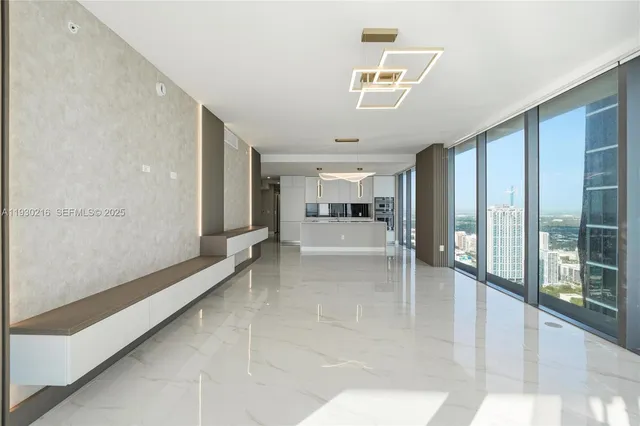 a bathroom with a sink a toilet and a window