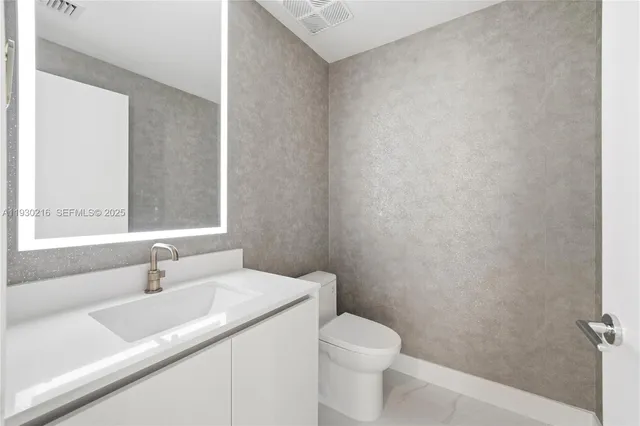 a view of a bathroom with a glass door