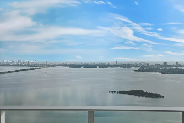 a view of an empty room and a bathroom