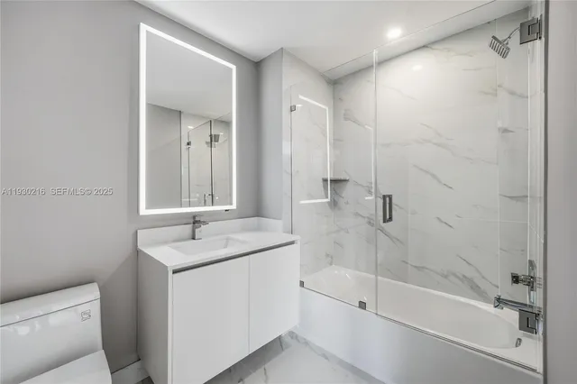 an empty room with closet and cabinet