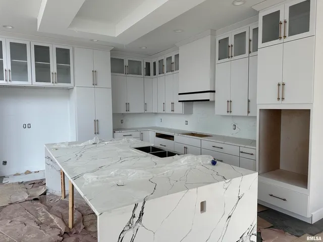 a kitchen that has a cabinets and a stove