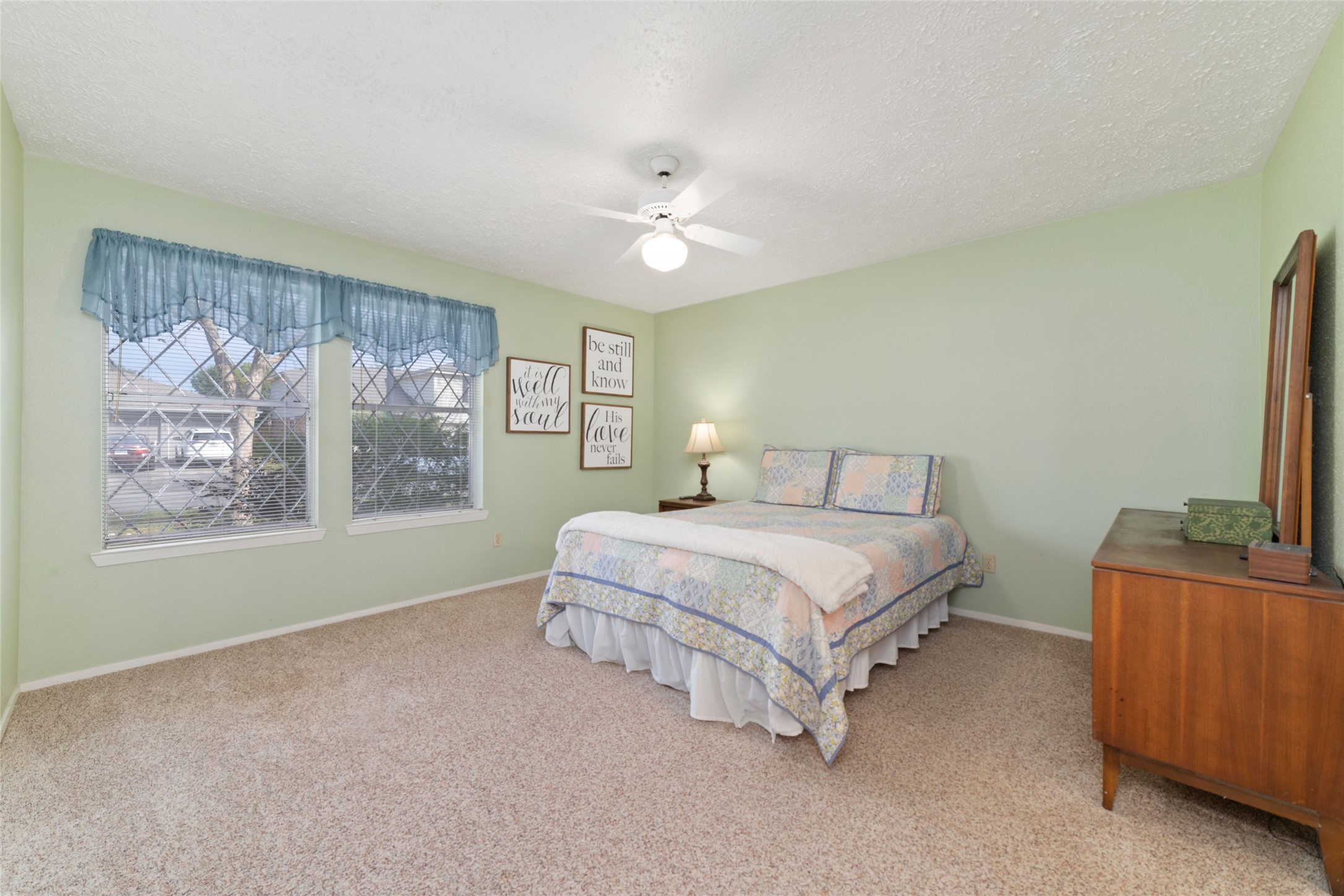4711 Lost Lake Lane Spring, TX 77388 - Photo 14 of 26 a spacious bedroom with a bed and a flat screen tv