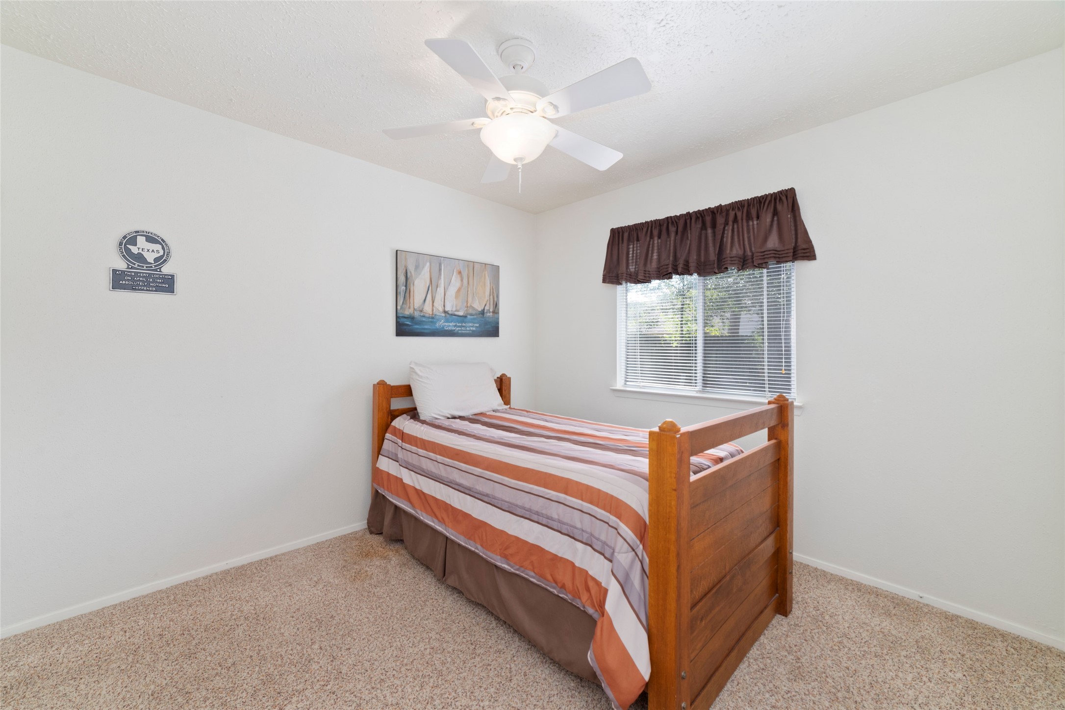 4711 Lost Lake Lane Spring, TX 77388 - Photo 16 of 26 a room with a bed and a window